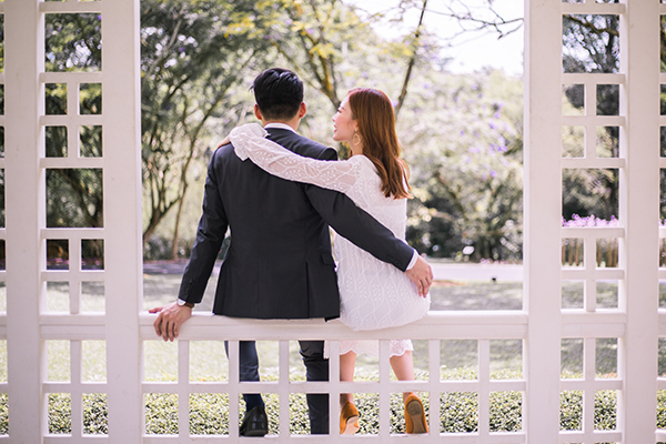 Attractive girl in denim jacket embracing boyfriend. Smiling caucasian  couple posing Stock Photo by look_studio