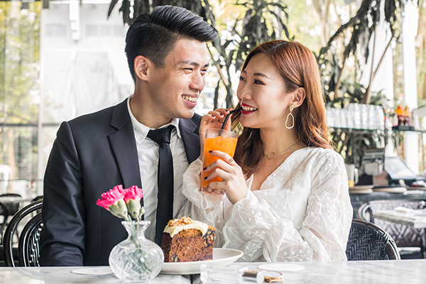 Lovely indian couple in love, wear at saree and elegant suit, posed on  restaurant. 10380640 Stock Photo at Vecteezy