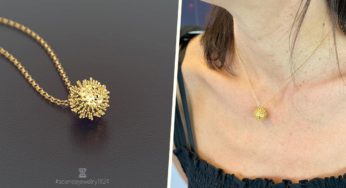 A Gold-Plated Coronavirus Necklace Exists & We’re Not Sure How To Feel About It